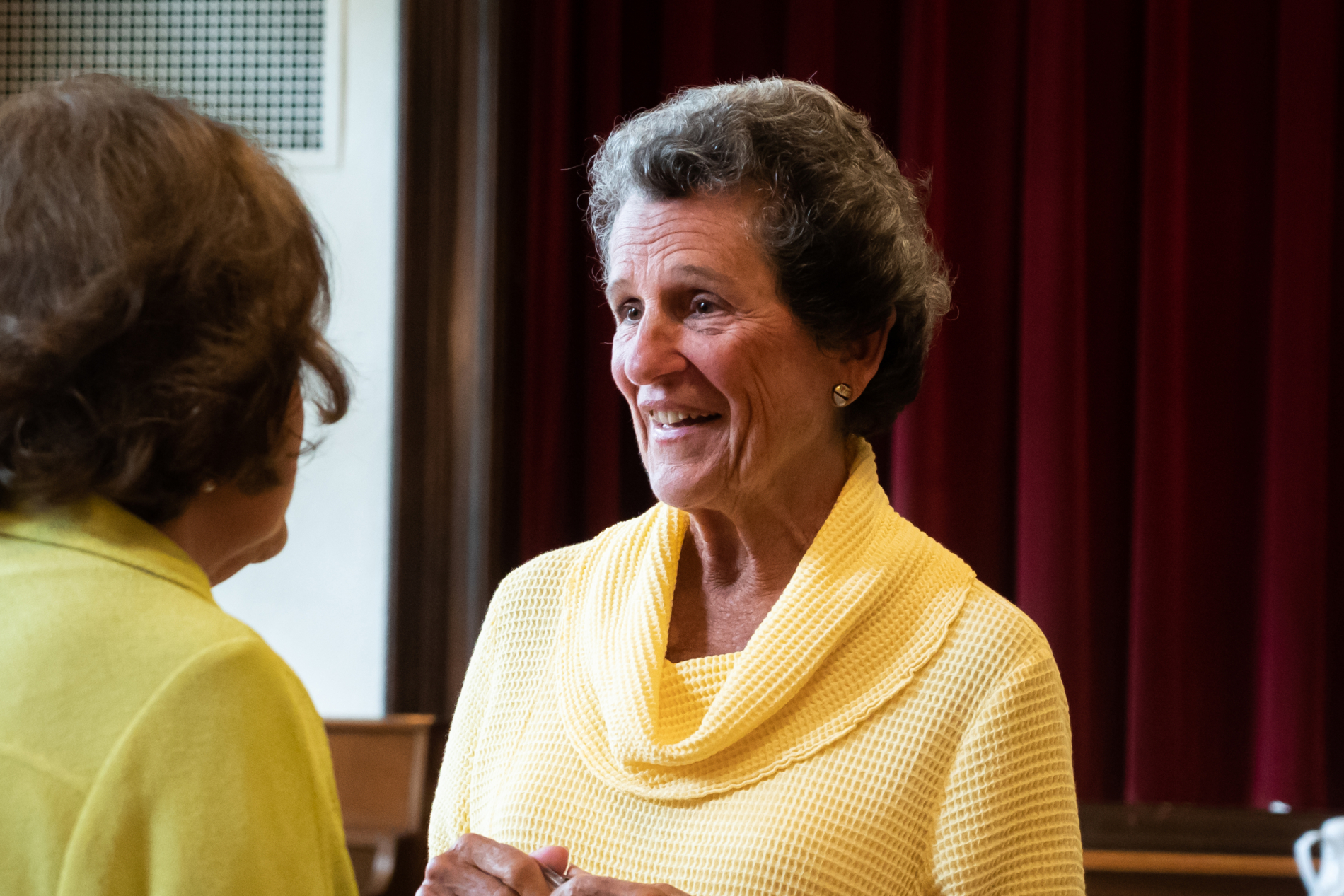 A woman talking to another woman