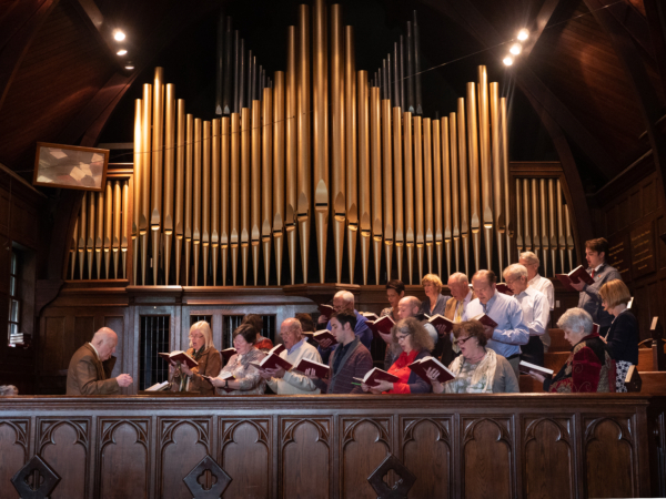 A church choir with organ pipes in the background